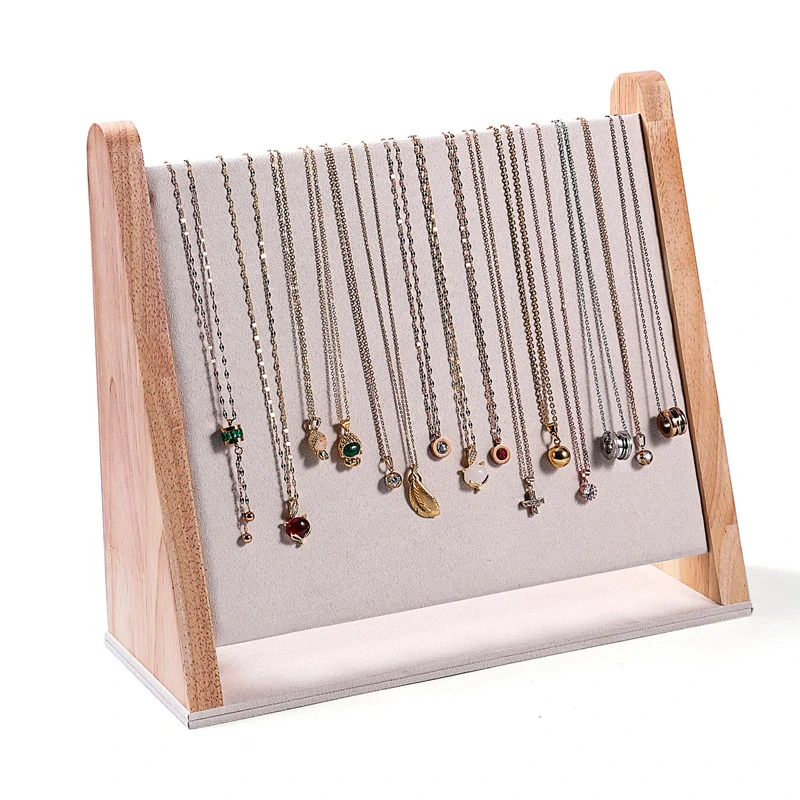 Stojanček, stojan, dekolt na retiazky biela