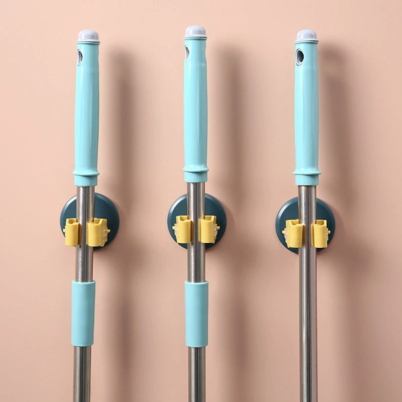 Samolepiaci nástenný držiak na mop zeleno žltý