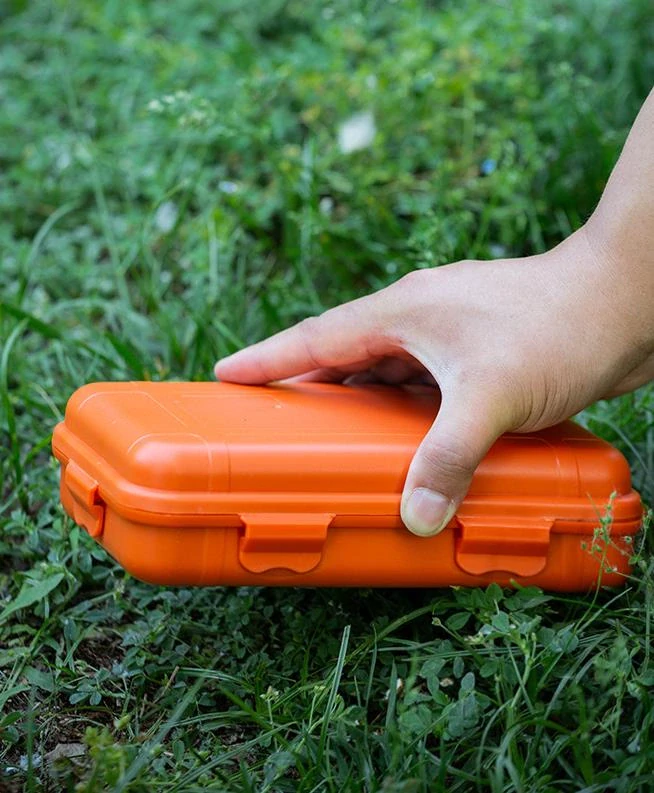 Vodotesný box na uloženie náradia EDC na prežitie v prírode M oranžový