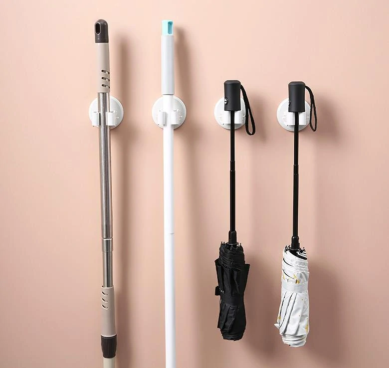 Samolepiaci nástenný držiak na mop zeleno žltý